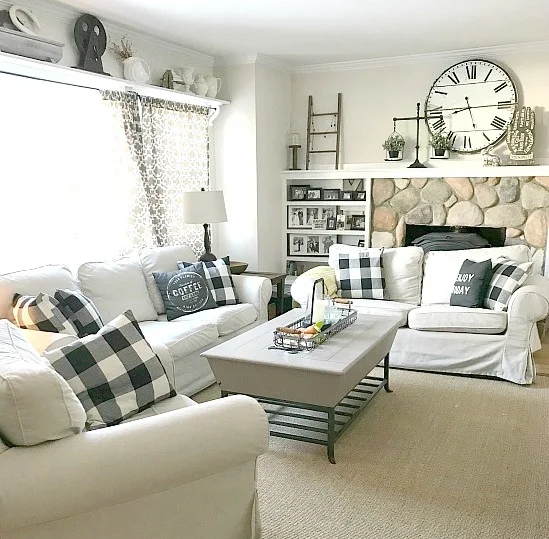 Farmhouse Style living room with white couches and buffalo check