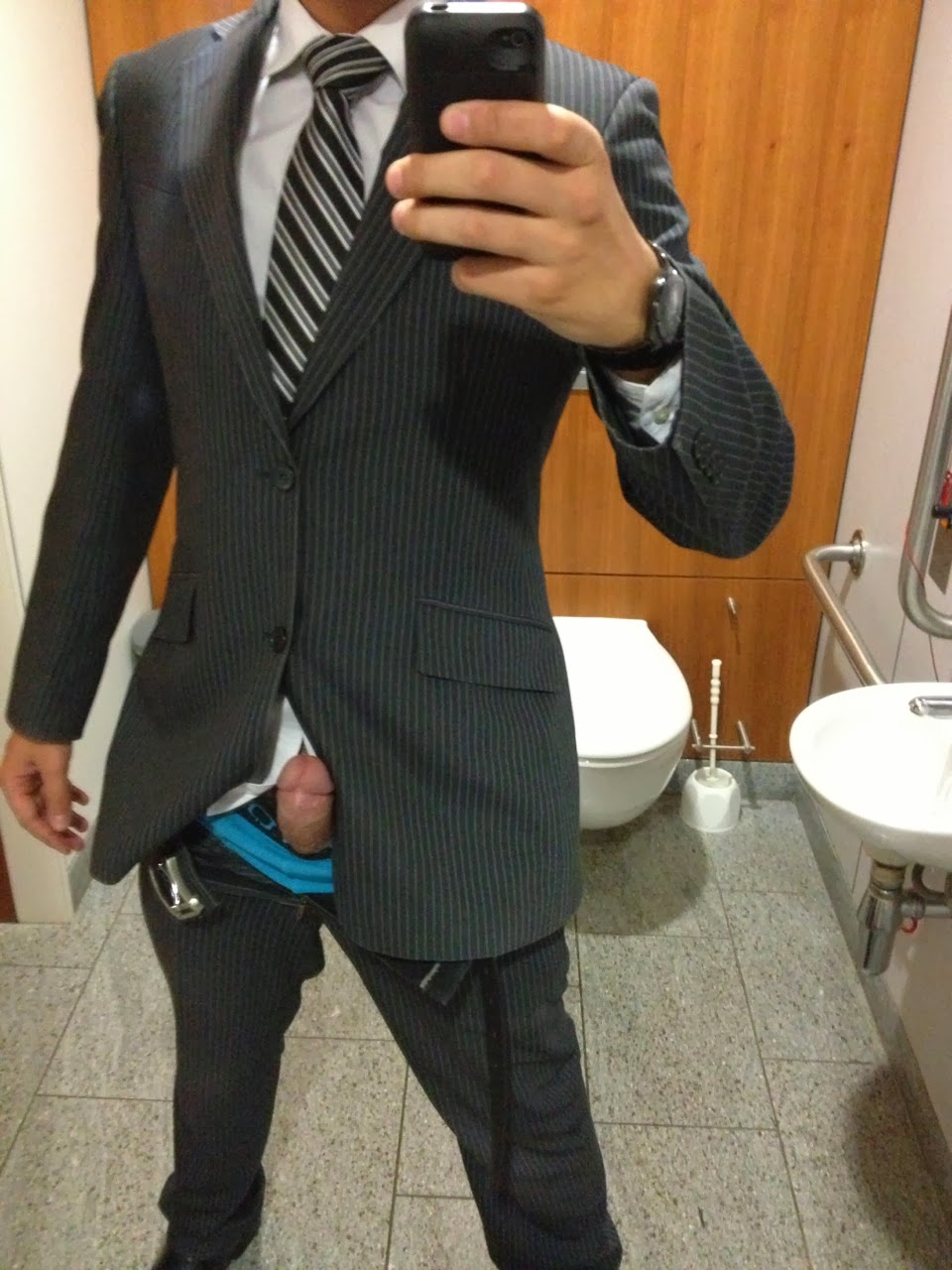 Mens suit holding there dick