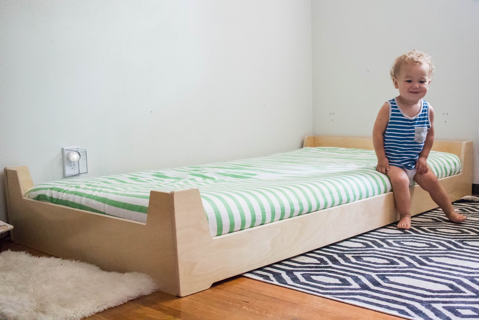 crib and mattress on floor