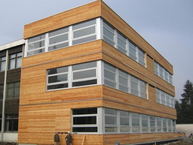 View of Budget Homes: Exterior finish for buildings - Green cladding