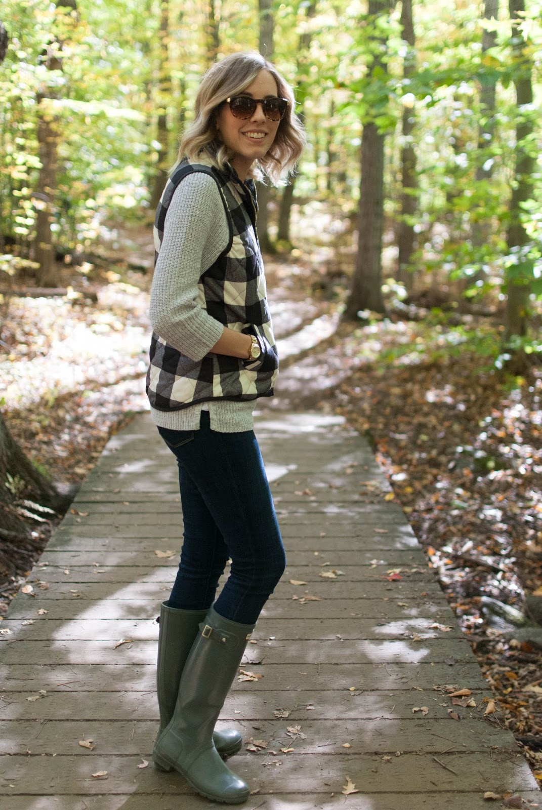 fall hiking outfit with quilted plaid vest