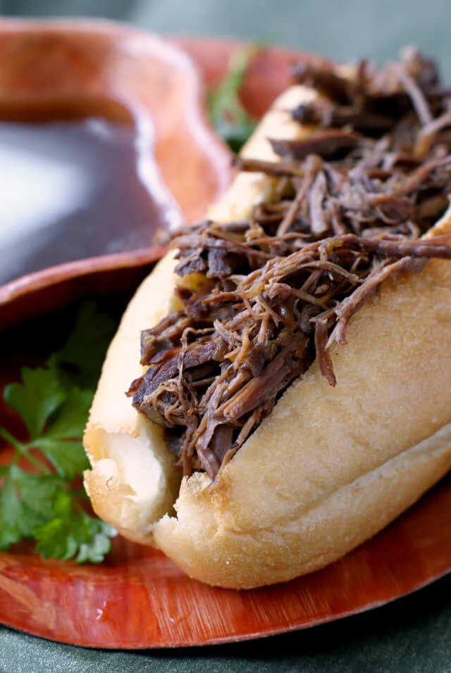 Crock Pot French Dips are super easy to make shredded beef sandwiches served alongside a rich au jus for dipping. #dinner #crockpot #frenchdip