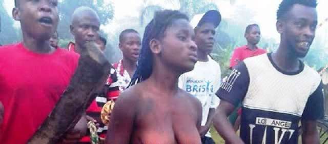 Despicable ! A Lady Is Been Stripped Naked For Stealing Chicken  (See Photo).
