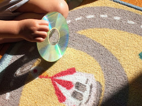 Reflecting sunshine to make a rainbow off a CD