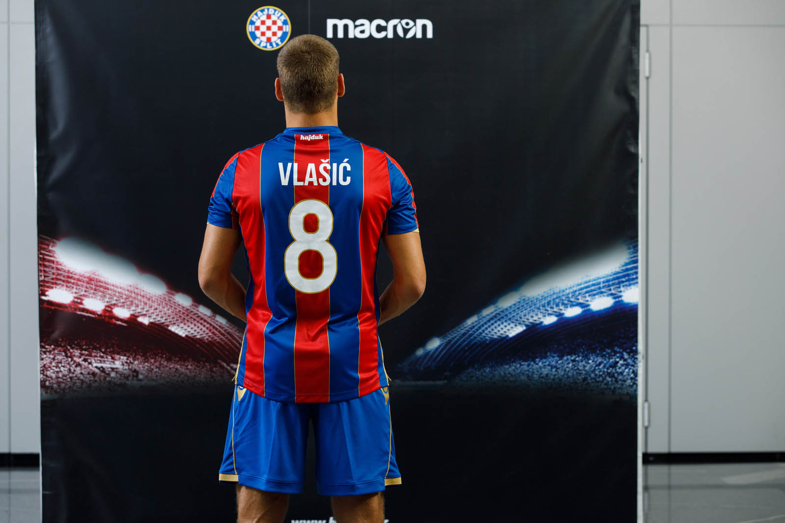 The Hajduk Split Away shirt 2017/18 has vertical red and blue bands with  gold details. The Macron logo stands out in white on the top right-hand  side of, By Macron