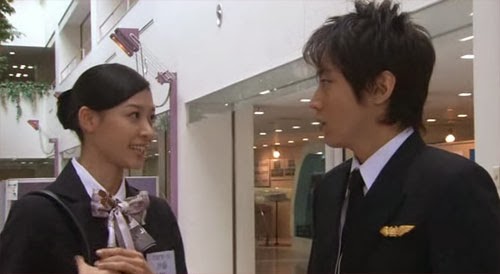 Tsutsumi looks troubled as the cabin attendant rejects him.