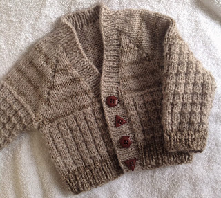 https://www.craftsy.com/knitting/patterns/warm-waffled-baby-cardigan/460026