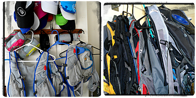Image of multiple hydration packs hanging in a full closet