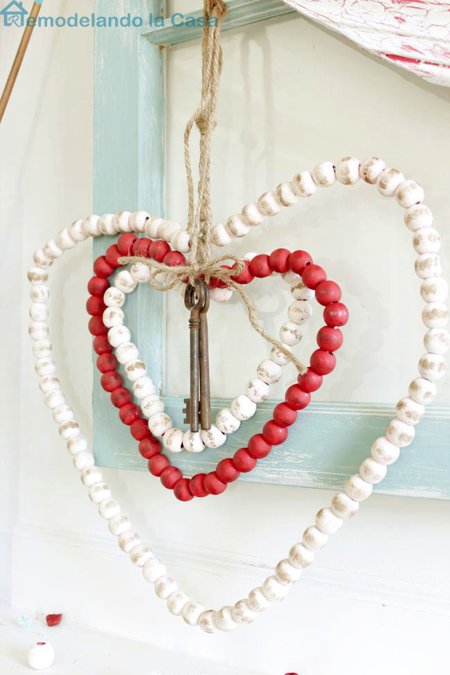 red wooden bead Christmas garland was repurposed into beaded hearts for Valentines