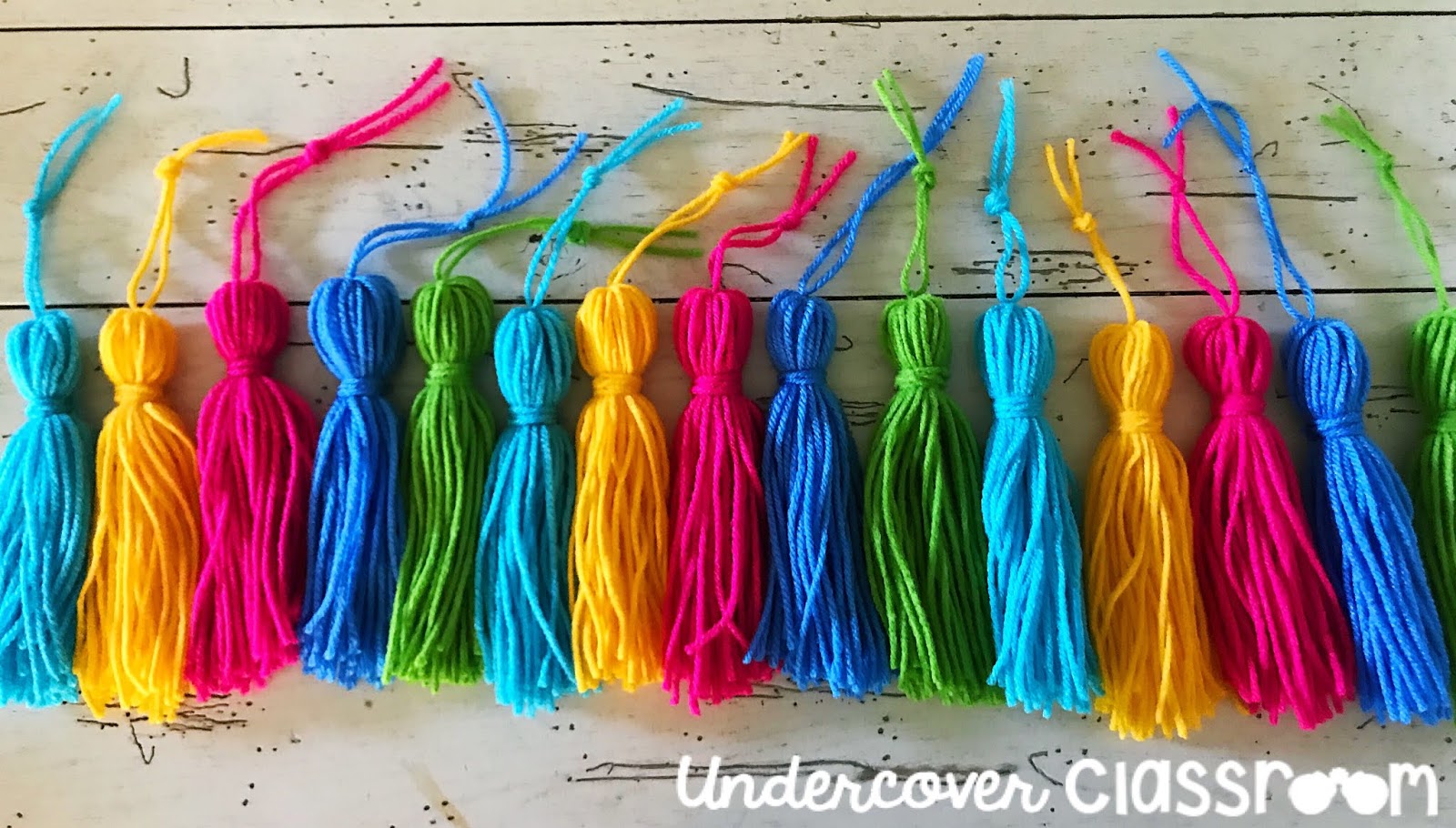 Spruce up your classroom with this DIY tassel garland. Follow these easy steps to make yarn tassels. It's easier than you think. Your bulletin boards will be looking jazzy in no time!