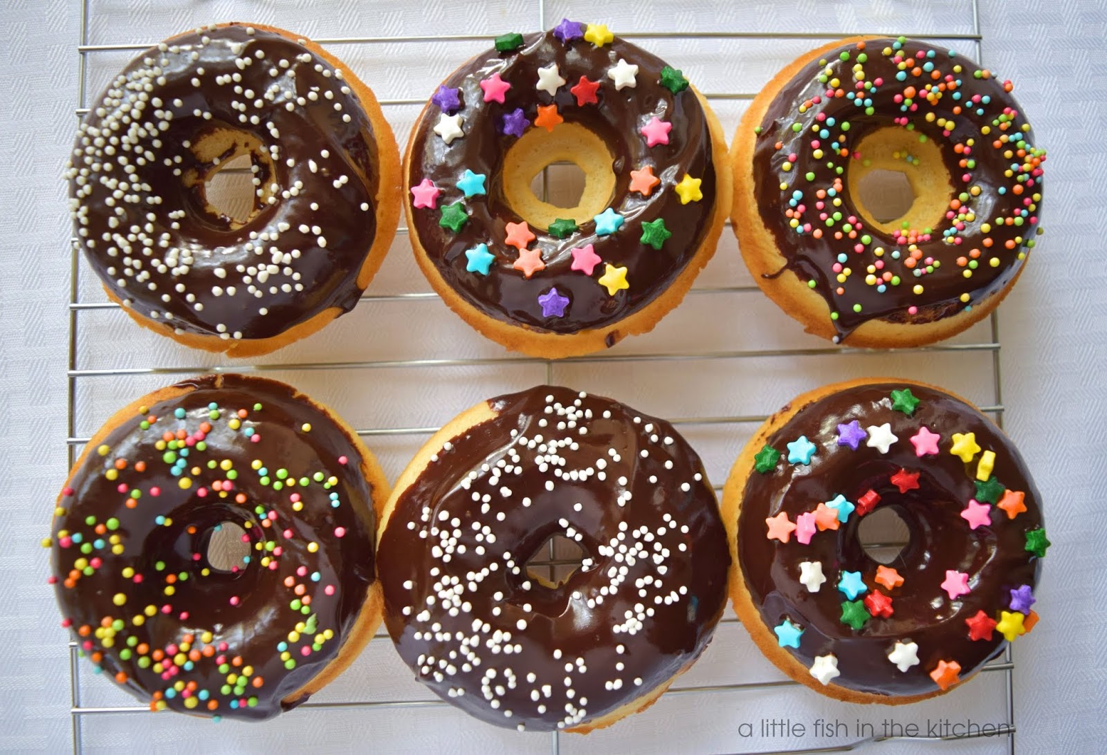Vanilla Cake Doughnuts with Easy Milk Chocolate Frosting A Little