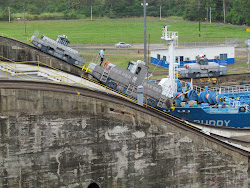 Twin "mules" in town, helping the BUDDY over the lock gate hump at the Panama Canal