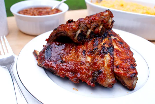 Oven Baked BBQ Baby Back Ribs are mouth-watering, tangy, juicy, tender and perfectly portioned!
