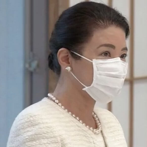 At Akasaka Imperial Residence. Empress Masako is wearing pearl earrings pearl necklace and white tweed jacket and skirt