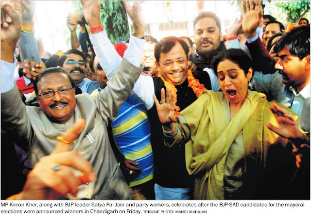 MP Kirron Kher, along with BJP leader Satya Pal Jain and party workers, celebrates after the BJP-SAD candidates for the mayoral elections were announced winners in Chandigarh