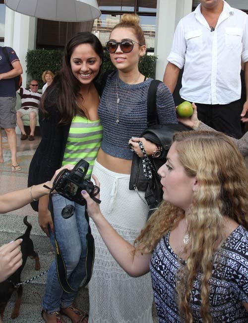 Buzz Images: Miley Cyrus greets fans outside her hotel (May 2012)