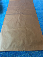large rectangular sheet of brown paper