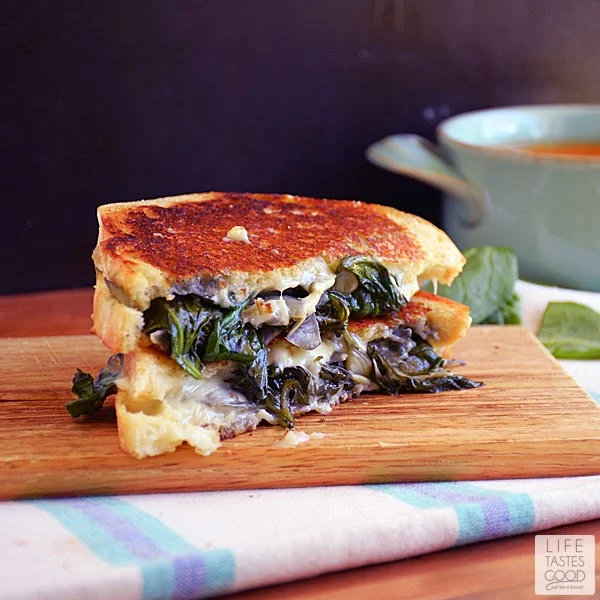 Spinach Artichoke Grilled Cheese | by Life Tastes Good is the classic dip in sandwich form and totally tasty! This Grilled Cheese sandwich is loaded with fresh spinach, artichokes, and lots of ooey gooey, melty cheese! It's a classic flavor combo, and I'm excited to share it with you in this tasty sandwich recipe! #SundaySupper