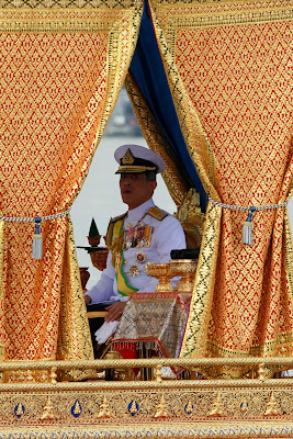 Thai Crown Prince Maha Vajiralongkorn sits on the Royal Barge during the Royal Barge Procession on the Chao Phraya River in Bangkok November 9, 2012.