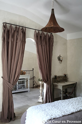 an antique speaker from a gramophone is transformed into a hanging light in the french guest house Un Cœur très Nature