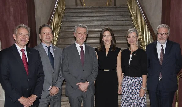 Crown Princess Mary attended a meeting with UN Refugee Chief Filippo Grandi at Amalienborg Frederik VIII's Palace. she wore black dress by Prada