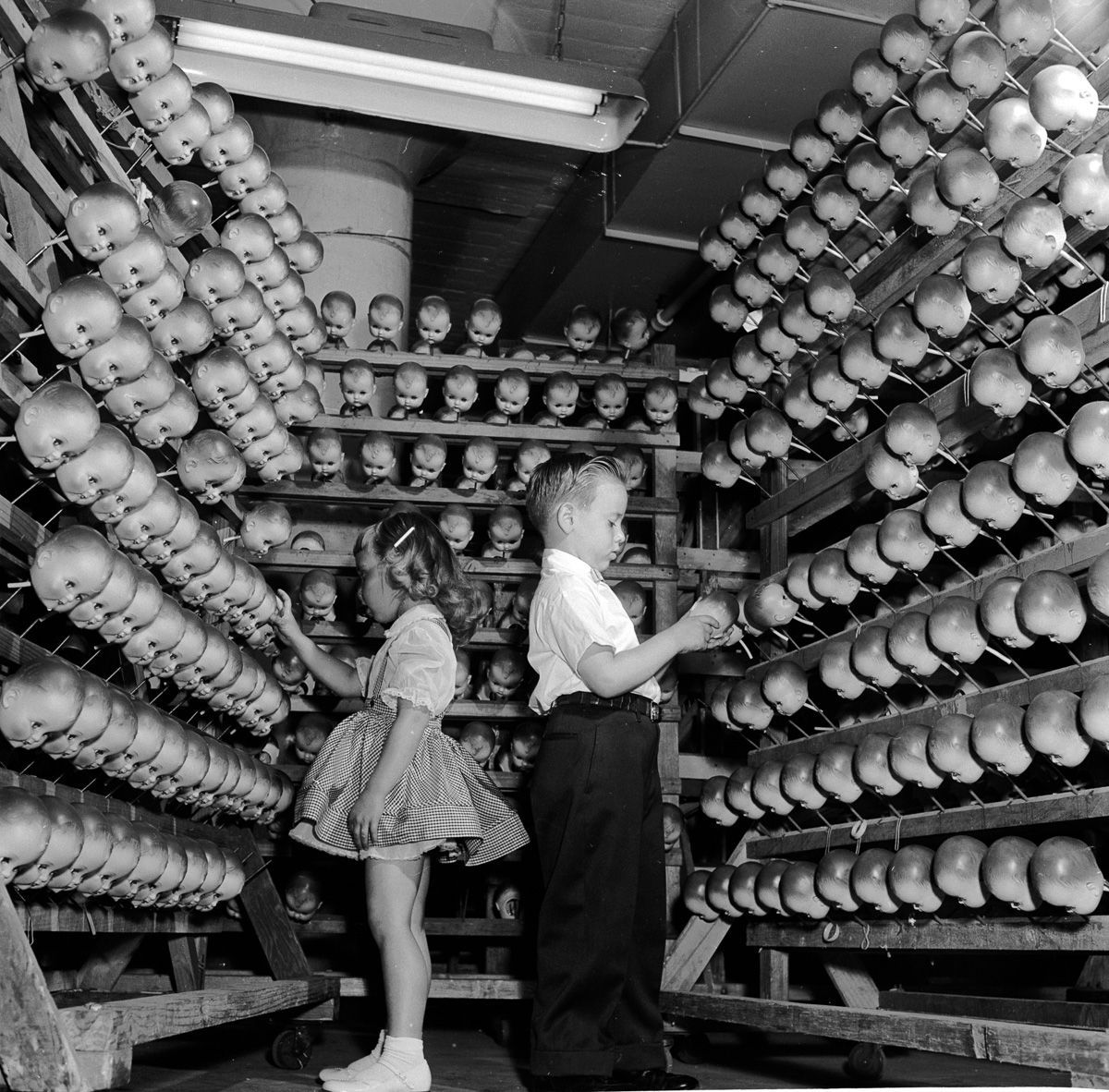 These 26 Vintage Photographs From Inside Old Doll Factories Will Make