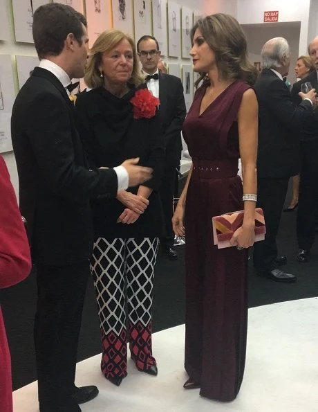 Queen Letizia wore Carılina Herrera Jumpsuit, Carolina Herrera Print-Clutch Bag, Carolina Herrera Suede pumps