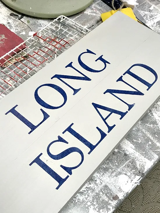 Long Island lettering on a wooden sign