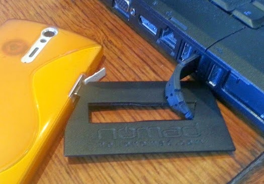 NOMAD ChargeCard USB in use with phone and laptop