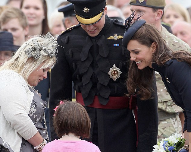 Kate in command: Duchess of Cambridge does dress uniform as she carries ...
