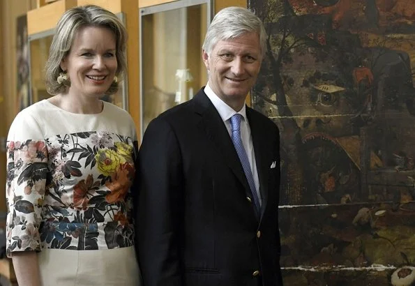 King Philippe and Queen Mathilde visited the painting restoration workshop of the Royal Institute for Cultural Heritage. Mathilde wore Dries Van Noten dress