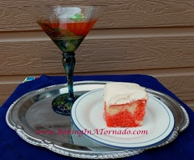 Cosmo Poke Cake | www.BakingInATornado.com