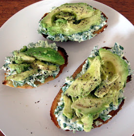 tosted sourdough with cream cheese, herbs, and avocado