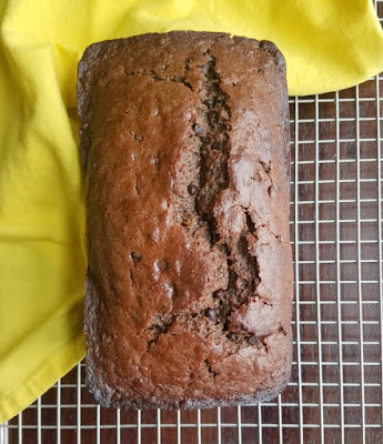 loaf of chocolate banana sourdough quick bread on cooling rack