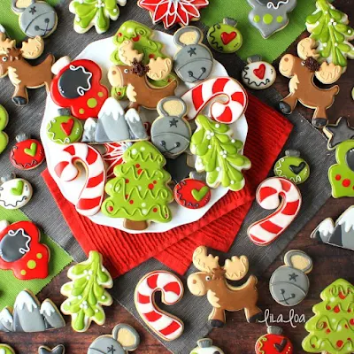 Brightly colored and fun Christmas sugar cookies - mistletoe, moose, ornaments and candy canes!