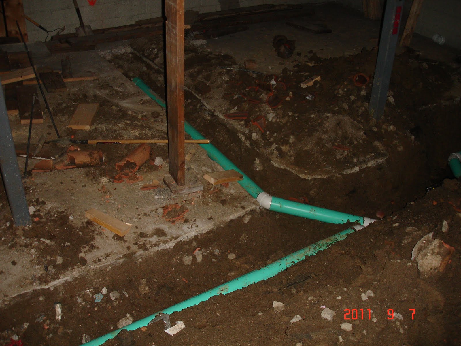 The Reno Coach Passive House Project in Toronto Drain pipes aere being layed in Basement Backup
