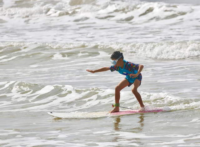 Kids surfing in Weligama beach | visitweligama.org