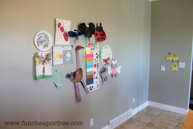 Cluttered wall with kids' artwork, from Fun Cheap or Free