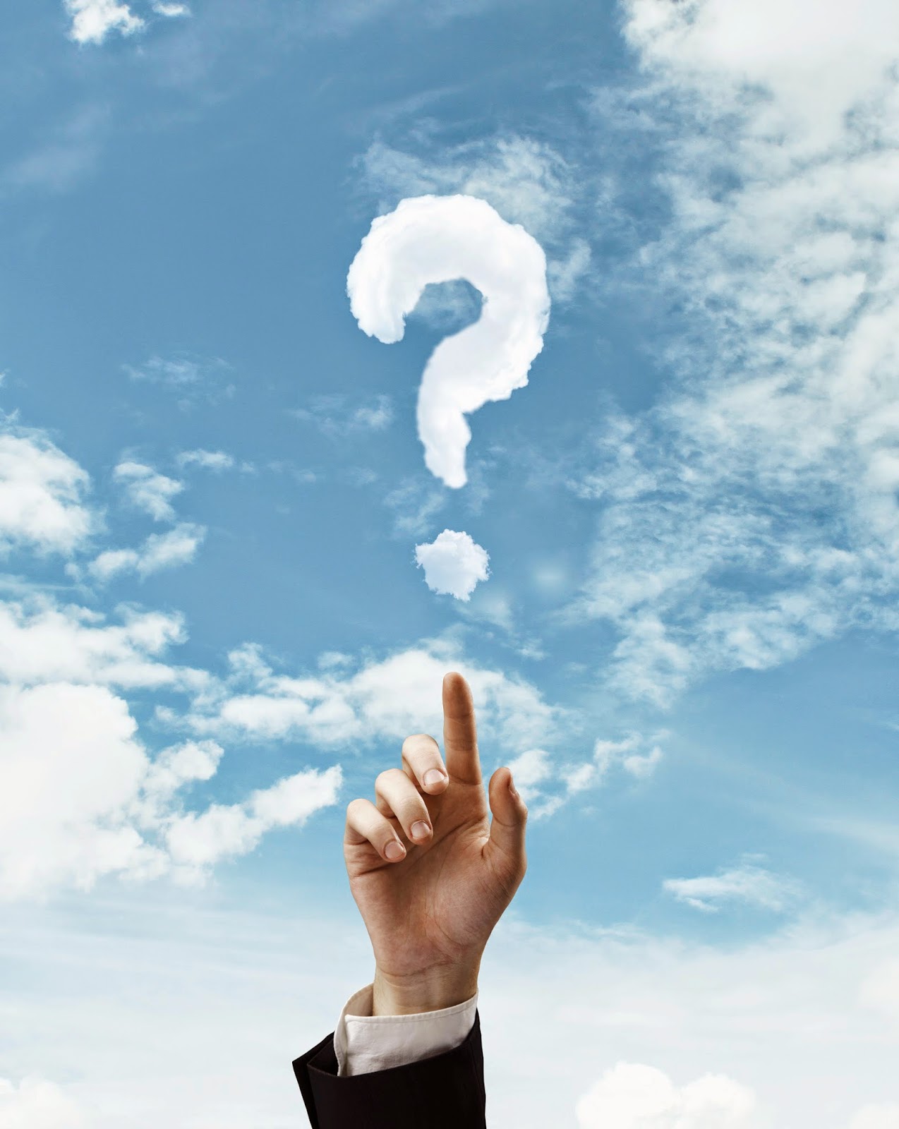 Finger pointing at question mark in the clouds