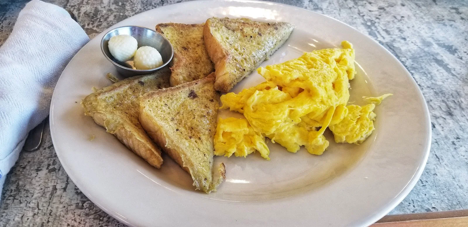 French Toast and Scrambled Eggs with Cheese at Huey's Southern Eats