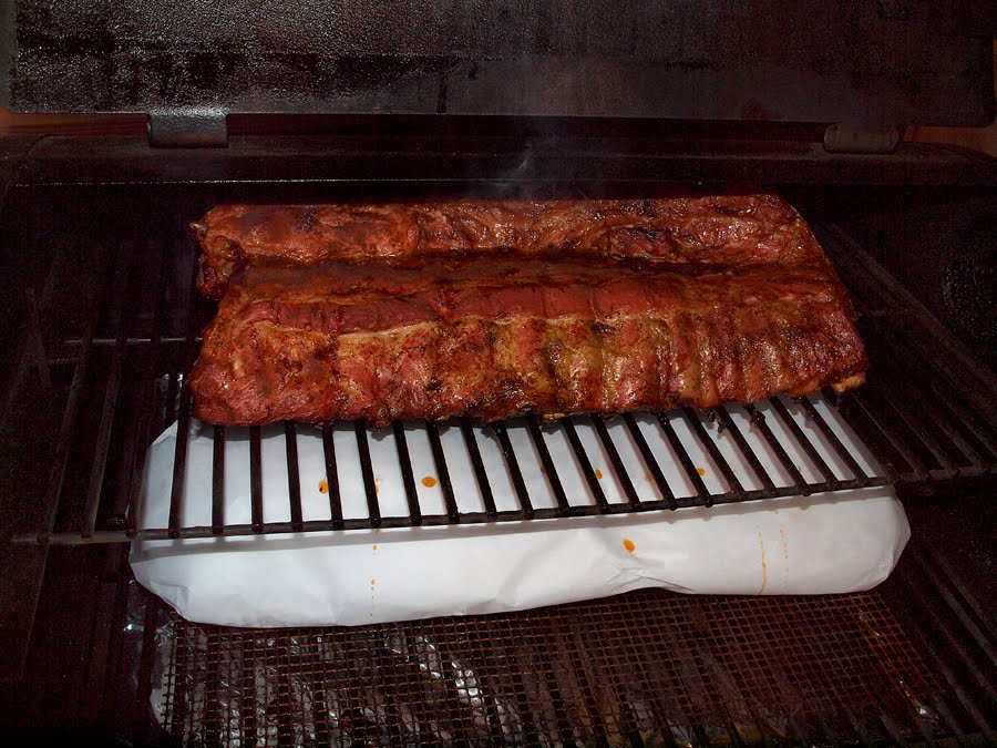 Pellet Smoker Cooking Pork Back Ribs in Parchment Paper