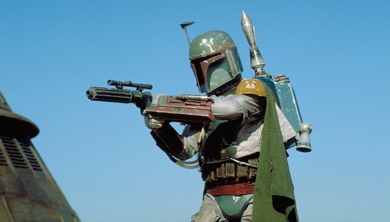 HOW IS THIS NOT COOL Boba Fett in armor with various accoutrements pointing a gun at something out of frame