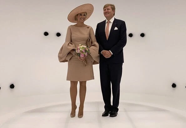 Brandenburg's Prime Minister Dietmar Woidke and his wife Susanne Woidke. Queen mMaxima wore Natan dress