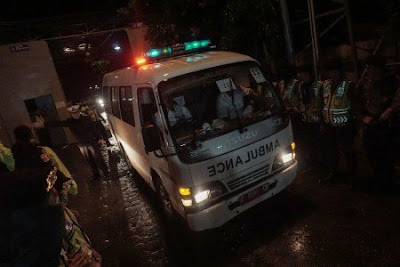 An ambulance carrying the body of one of the four executed drug convicts leaves Cilacap, Central Java on July 29, 2016