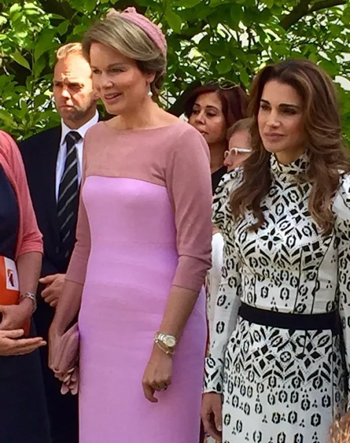Queen Mathilde and Queen Rania visit Bruges, Belgium. Queen Rania wore Louis Vuitton dress and Louis Vuitton bags. Queen Mathilde wore Natan dress