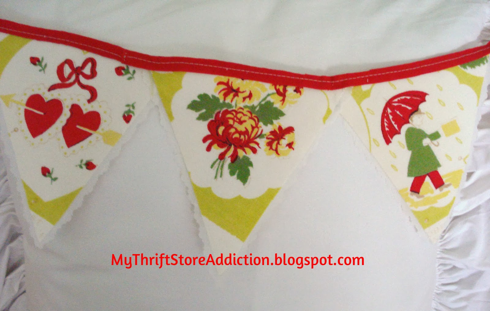 Vintage calendar tablecloth repurposed as bunting banner! mythriftstoreaddiction.blogspot.com vintage tablecloth