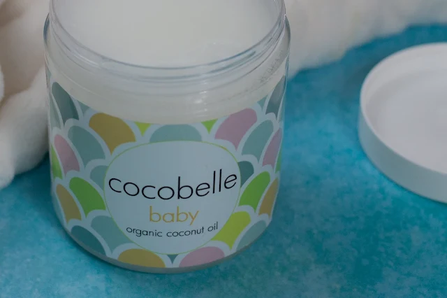 An open jar of Cocobelle Baby Organic Coconut Oil