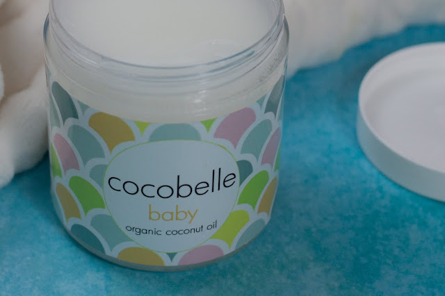 An open jar of Cocobelle Baby Organic Coconut Oil