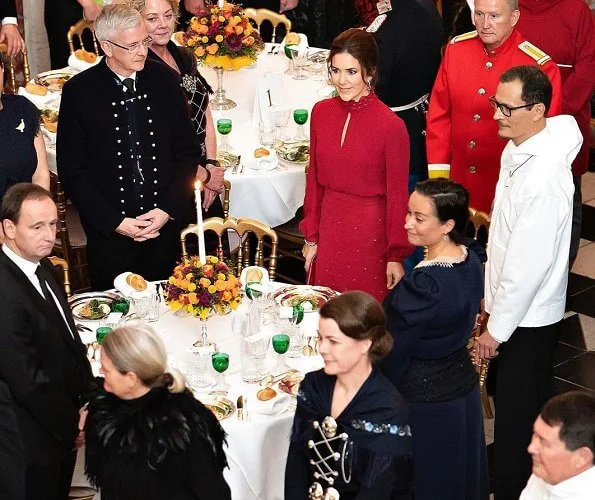 Crown Prince Frederik and Crown Princess Mary, hosted a concert a dinner in the Dome Hall. red skirt and blouse