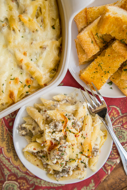 Three Cheese Italian Sausage Alfredo Bake - great make-ahead pasta dish. Elbow macaroni, alfredo sauce, sour cream, ricotta, garlic, italian sausage, eggs, parmesan and mozzarella cheese. SO good!! We make this at least once a month! Can freeze half for later. This is THE BEST pasta casserole we've ever eaten!!! #casserole #freezermeal #pasta #pastacasserole Three Cheese Italian Sausage Alfredo Bake - great make-ahead pasta dish. Elbow macaroni, alfredo sauce, sour cream, ricotta, garlic, italian sausage, eggs, parmesan and mozzarella cheese. SO good!! We make this at least once a month! Can freeze half for later. This is THE BEST pasta casserole we've ever eaten!!! #casserole #freezermeal #pasta #pastacasserole
